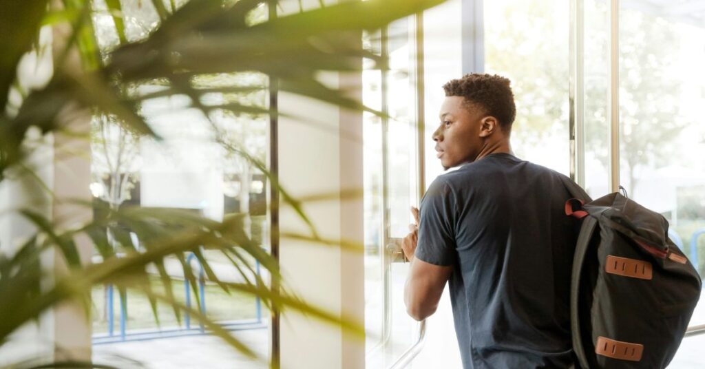 A determined student studying at a library in The Hills District. Plan your financial future and achieve homeownership with GT Financial Services, even with a HECS debt.